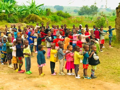 Children standing in several lines outdoors